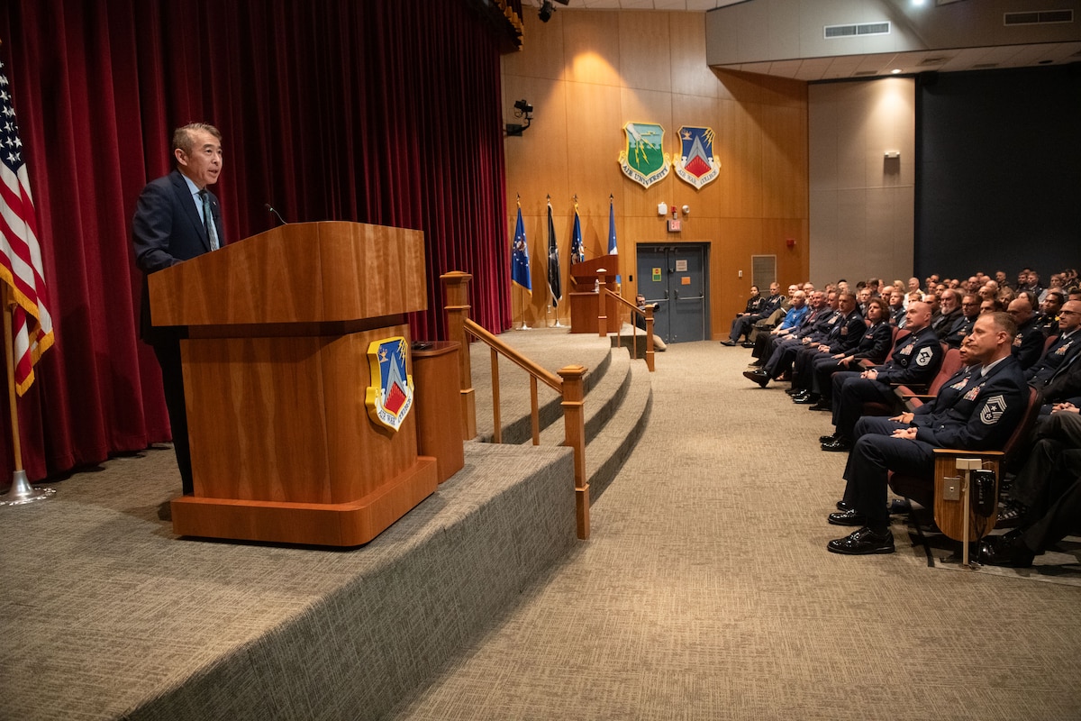 Edwin Oshiba, Performing the Duties of Under Secretary of the Air Force, briefs civic leaders from across the country at the National Security Forum at Maxwell Air Force Base, Alabama, May 6, 2025. This is the 71st anniversary of the SecAF-sponsored NSF hosted by Air University's Air War College, May 6-8, 2025. (U.S. Air Force photo by Trey Ward)