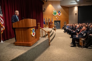 Edwin Oshiba, Performing the Duties of Under Secretary of the Air Force, briefs civic leaders from across the country at the National Security Forum at Maxwell Air Force Base, Alabama, May 6, 2025. This is the 71st anniversary of the SecAF-sponsored NSF hosted by Air University's Air War College, May 6-8, 2025. (U.S. Air Force photo by Trey Ward)