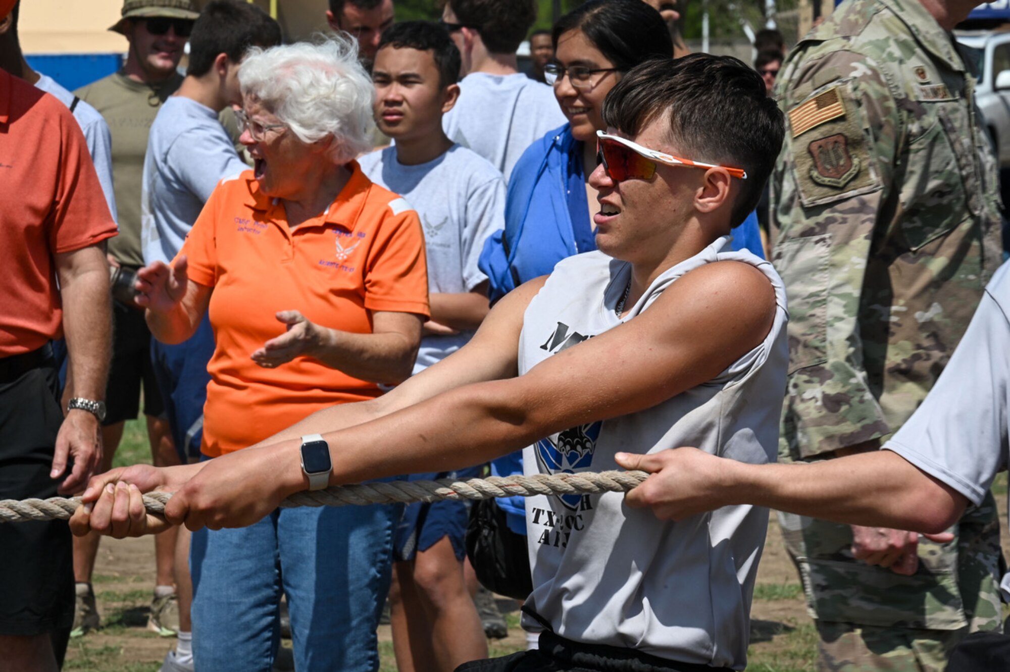 Student being cheered on in tug-of-war contest