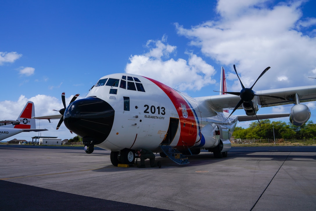An HC-130 Hercules airplane crew prepares to launch from Coast Guard Air Station Barbers Point in Kapolei, Hawaii, May 7, 2025. The crew airdropped antibiotics to a 68-year-old man who had reportedly been experiencing severe abdominal pain 675 miles offshore Hawaii. (U.S. Coast Guard photo by Petty Officer 3rd Class Avery Tibbets)