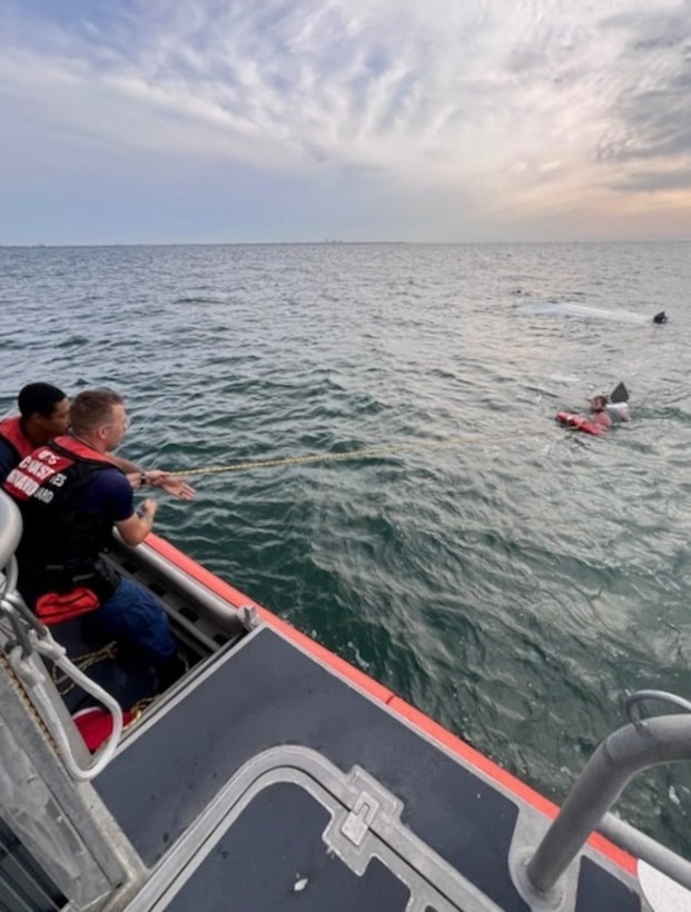A Coast Guard Station St. Petersburg boat crew rescues a man after his 15-foot vessel capsized near the Sunshine Skyway Bridge. Sharing his float plan with his wife, and coordination between St. Petersburg Fire Rescue and Pinellas County Sheriff’s Office crews helped save the man's life. (U.S. Coast Guard photo)