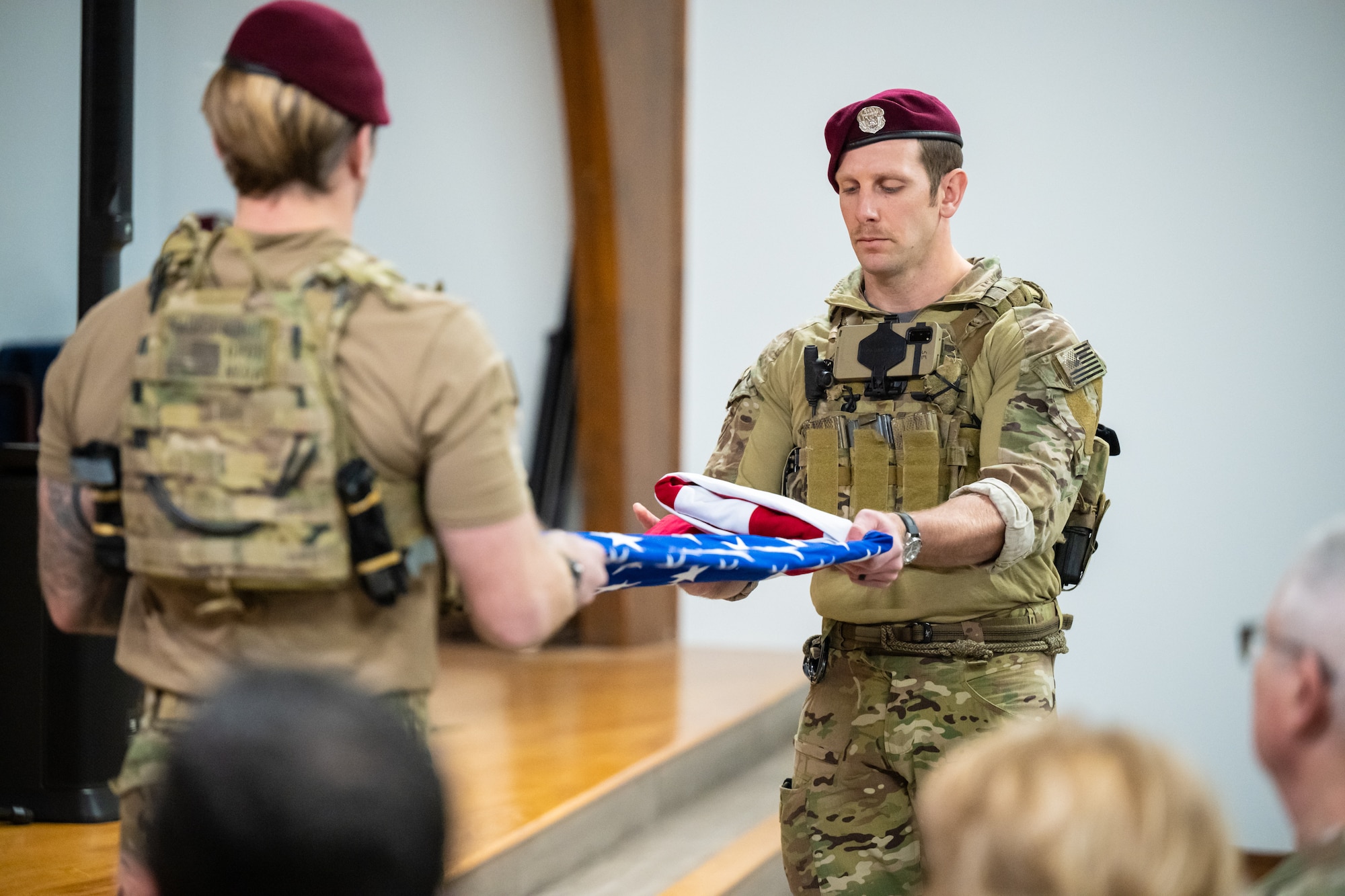 Members of the 123rd Special Tactics Squadron perform a flag-folding during the retirement ceremony for Callie, the only certified search-and-rescue dog in the Department of Defense, at the Kentucky Air National Guard Base in Louisville, Ky., Jan. 24, 2025. Over the course of more than six years with the unit, Callie served on numerous exercises and six real-world deployments, searching for survivors in the aftermath of floods, tornadoes, a mine collapse and an avalanche. (U.S. Air National Guard photo by Dale Greer)