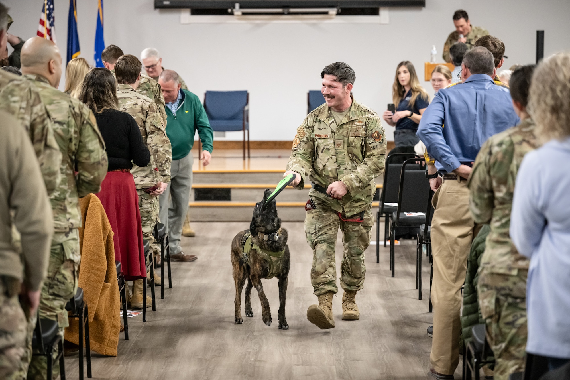 Callie, the only certified search-and-rescue dog in the Department of Defense, is ready for some well-earned play time at the conclusion of her retirement ceremony at the Kentucky Air National Guard Base in Louisville, Ky., Jan. 24, 2025. Over the course of more than six years with the 123rd Special Tactics Squadron, Callie served on numerous exercises and six real-world deployments, searching for survivors in the aftermath of floods, tornadoes, a mine collapse and an avalanche. (U.S. Air National Guard photo by Dale Greer)