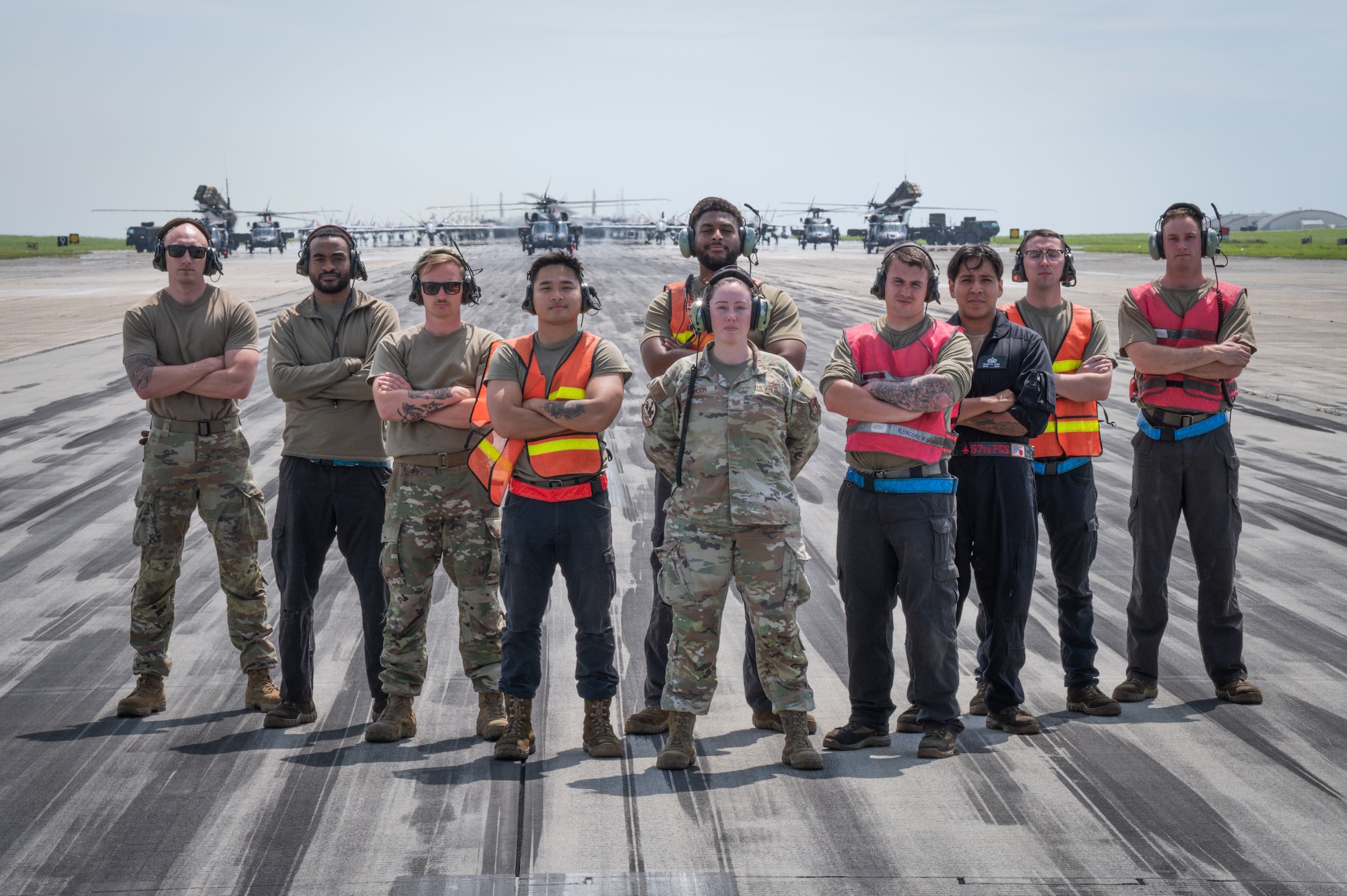 Members of the 67th Fighter Generation Squadron and 33rd Rescue Generation Squadron pose for a photo