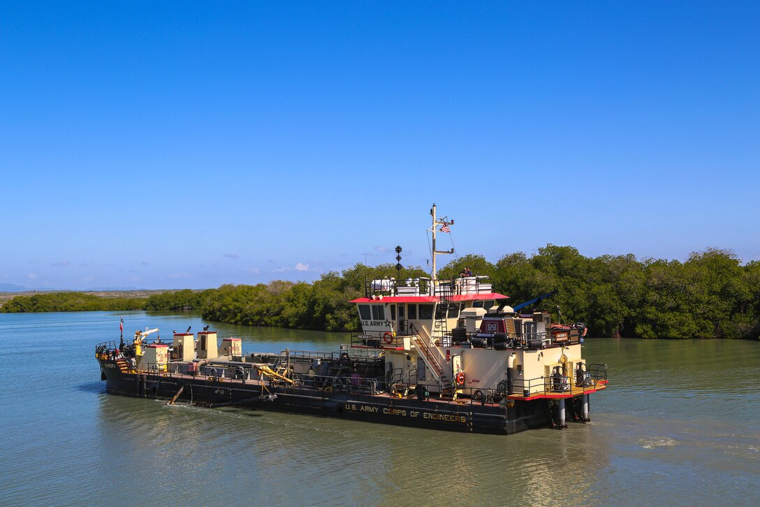 U.S. Army Corps of Engineers, (USACE), Dredge MURDEN pumps sand and slurry materials during 24/7 dredge operations in Naval Station Guantanamo Bay, Cuba, April 23, 2025. Dredge MURDEN is clearing critical shoaling by dredging areas that will maintain safe and efficient navigation conditions for military and commercial vessels in the harbor. (USACE Photo by Mark Rankin)
