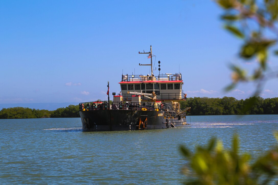 U.S. Army Corps of Engineers, (USACE), Dredge MURDEN pumps sand and slurry materials during 24/7 dredge operations in Naval Station Guantanamo Bay, Cuba, April 23, 2025. Dredge MURDEN is clearing critical shoaling by dredging areas that will maintain safe and efficient navigation conditions for military and commercial vessels in the harbor. (USACE Photo by Mark Rankin)