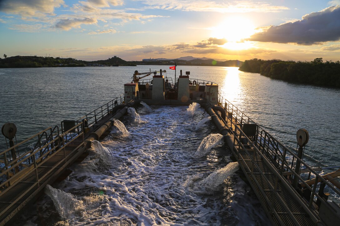 U.S. Army Corps of Engineers, (USACE), Dredge MURDEN pumps sand and slurry materials during 24/7 dredge operations in Naval Station Guantanamo Bay, Cuba, April 23, 2025. Dredge MURDEN is clearing critical shoaling by dredging areas that will maintain safe and efficient navigation conditions for military and commercial vessels in the harbor. (USACE Photo by Mark Rankin)