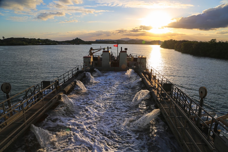 U.S. Army Corps of Engineers, (USACE), Dredge MURDEN pumps sand and slurry materials during 24/7 dredge operations in Naval Station Guantanamo Bay, Cuba, April 23, 2025. Dredge MURDEN is clearing critical shoaling by dredging areas that will maintain safe and efficient navigation conditions for military and commercial vessels in the harbor. (USACE Photo by Mark Rankin)