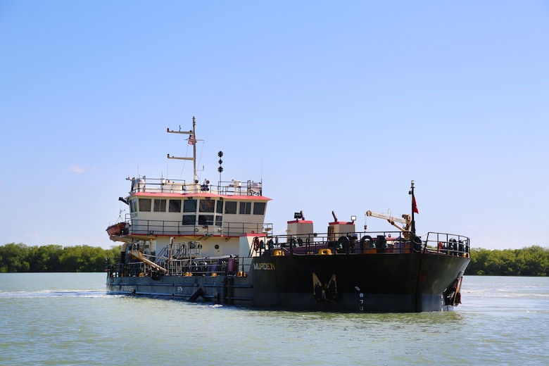 U.S. Army Corps of Engineers, (USACE), Dredge MURDEN pumps sand and slurry materials during 24/7 dredge operations in Naval Station Guantanamo Bay, Cuba, April 23, 2025. Dredge MURDEN is clearing critical shoaling by dredging areas that will maintain safe and efficient navigation conditions for military and commercial vessels in the harbor. (USACE Photo by Mark Rankin)