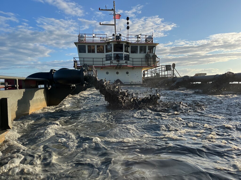 U.S. Army Corps of Engineers, (USACE), Dredge MURDEN pumps sand and slurry materials during 24/7 dredge operations in Naval Station Guantanamo Bay, Cuba, April 23, 2025. Dredge MURDEN is clearing critical shoaling by dredging areas that will maintain safe and efficient navigation conditions for military and commercial vessels in the harbor. (USACE Photo by Mark Rankin)