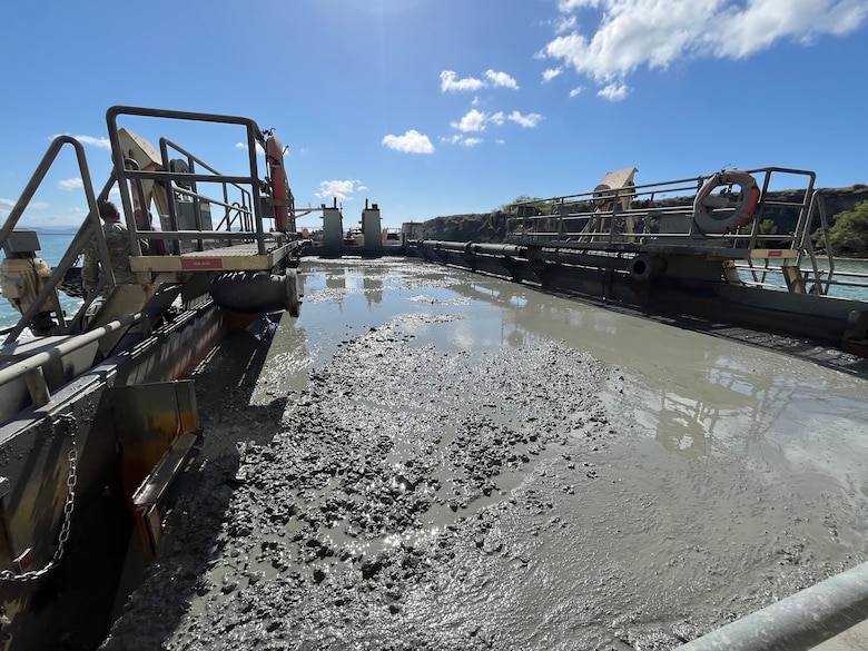 U.S. Army Corps of Engineers, (USACE), Dredge MURDEN pumps sand and slurry materials during 24/7 dredge operations in Naval Station Guantanamo Bay, Cuba, April 23, 2025. Dredge MURDEN is clearing critical shoaling by dredging areas that will maintain safe and efficient navigation conditions for military and commercial vessels in the harbor. (USACE Photo by Mark Rankin)