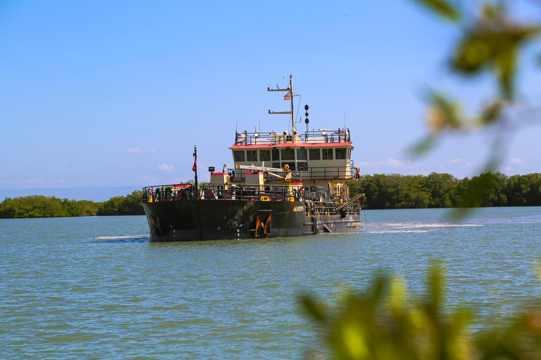 U.S. Army Corps of Engineers, (USACE), Dredge MURDEN pumps sand and slurry materials during 24/7 dredge operations in Naval Station Guantanamo Bay, Cuba, April 23, 2025. Dredge MURDEN is clearing critical shoaling by dredging areas that will maintain safe and efficient navigation conditions for military and commercial vessels in the harbor. (USACE Photo by Mark Rankin)