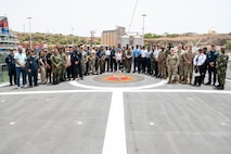 Distinguished visitors gather together for a group photo on board the Brazilian Navy Niterói-Class Frigate, BNS Defensora (F 41) during Obangame Express 2025. Obangame Express is one of three regional maritime exercises led by U.S. Sixth Fleet as part of a comprehensive strategy to provide collaborative opportunities to African forces and international partners to address maritime security concerns.