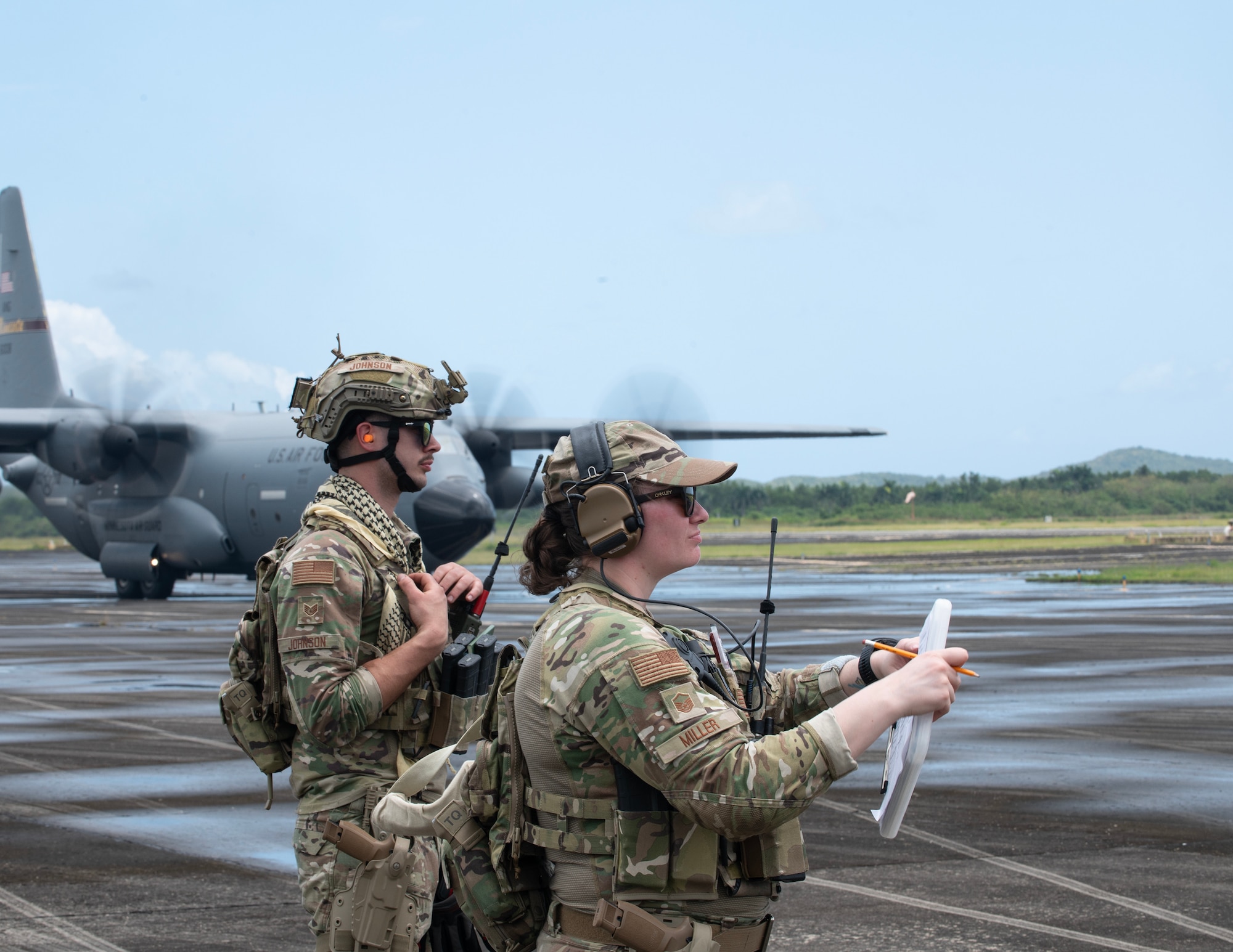 U.S. Air Force Master Sgt. Samantha Miller, right, and Staff Sgt. Isaac Johnson, left, 133rd Contingency Response Flight, Minnesota Air National Guard, monitors cargo as it is loaded onto a C-130 Hercules in Ceiba, Puerto Rico, April 8, 2025.