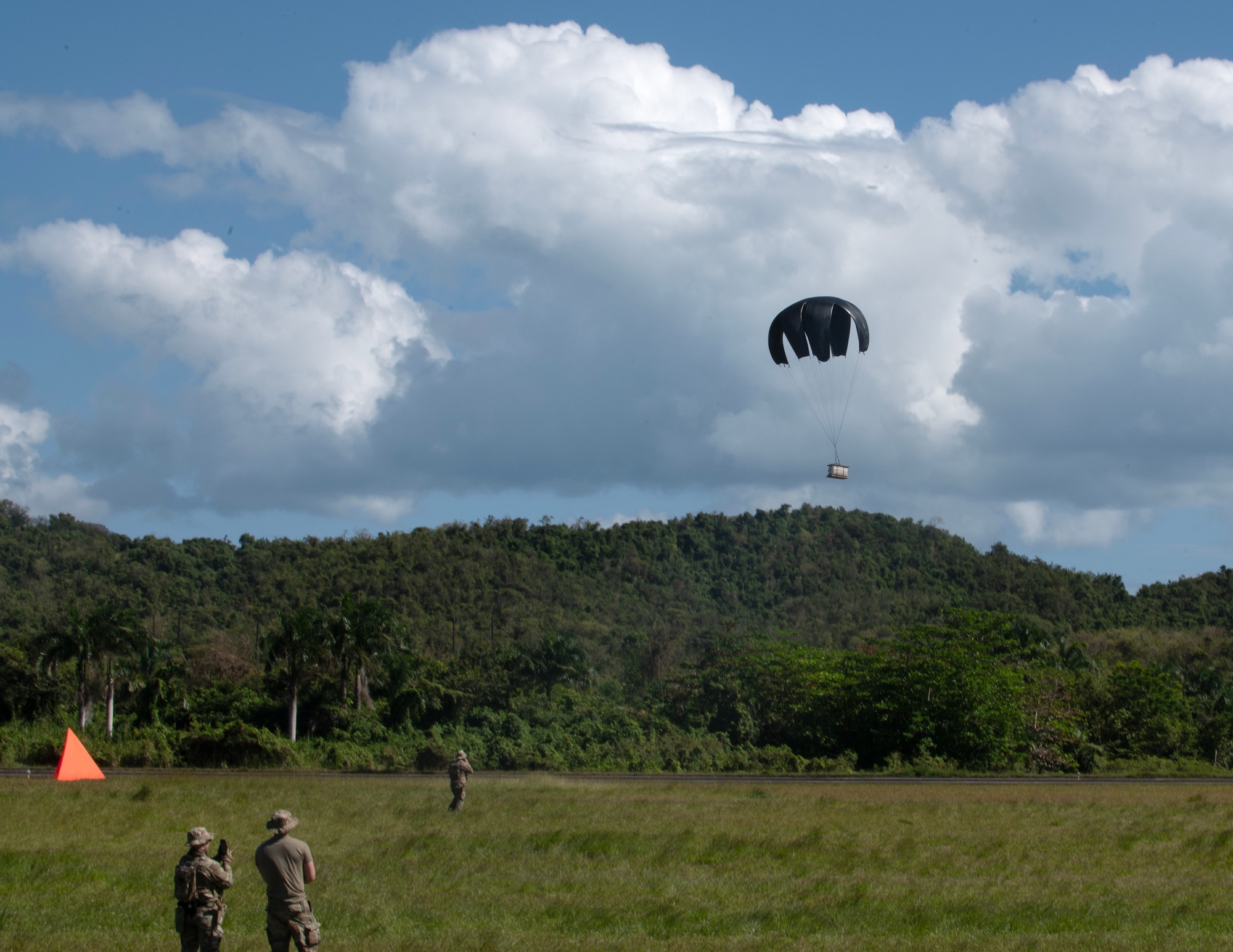 U.S. Air Force Airmen from the 133rd Contingency Response Flight, Minnesota Air National Guard, retrieve a low-cost, low-altitude (LCLA) bundle in Ceiba, Puerto Rico, April 8, 2025.