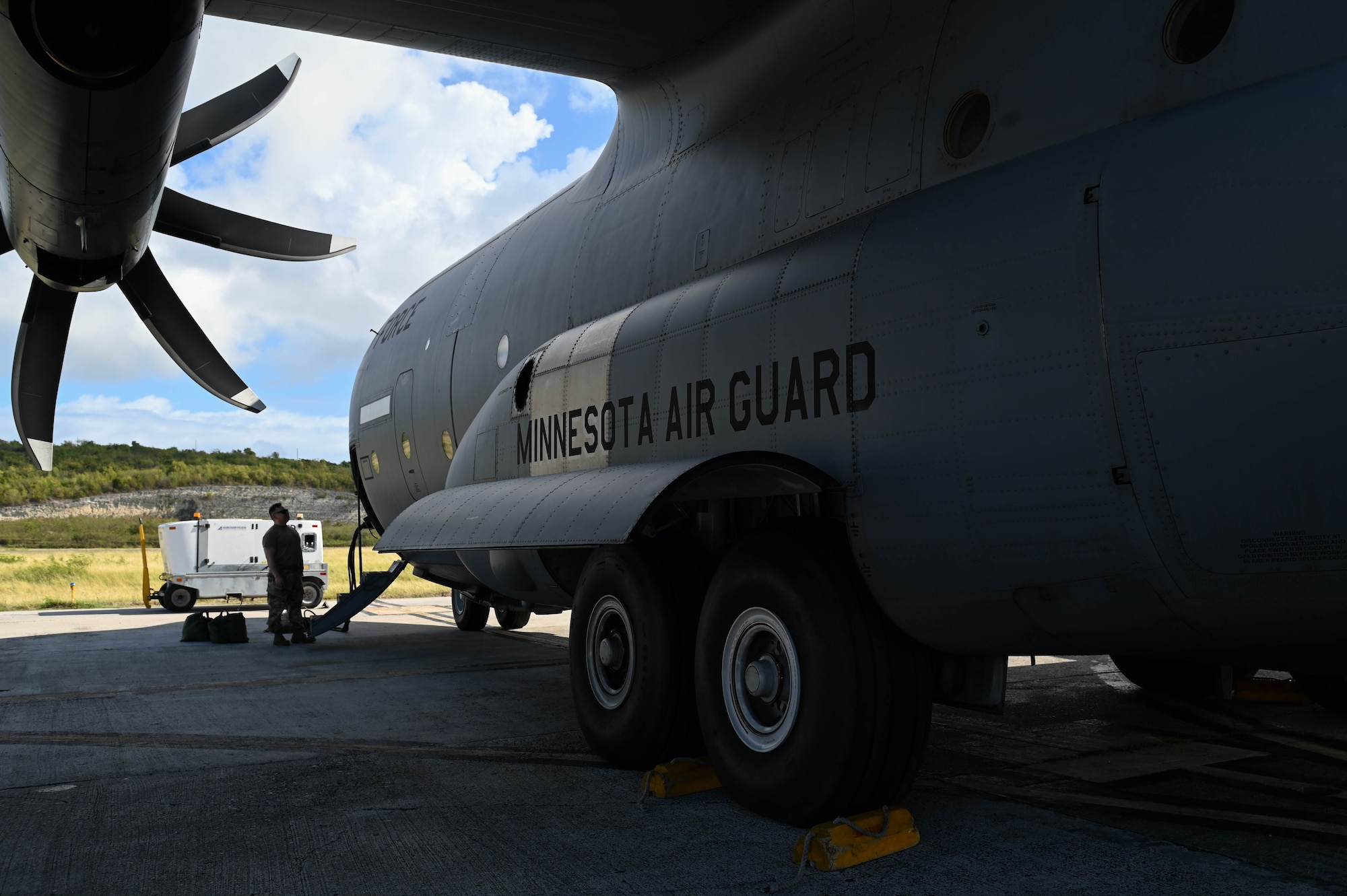 U.S. Air Force Airman with the 133rd Maintenance Group, Minnesota Air National Guard, performs pre-flight checks on a C-130 Hercules in St. Croix, U.S. Virgin Islands, April 8, 2025.