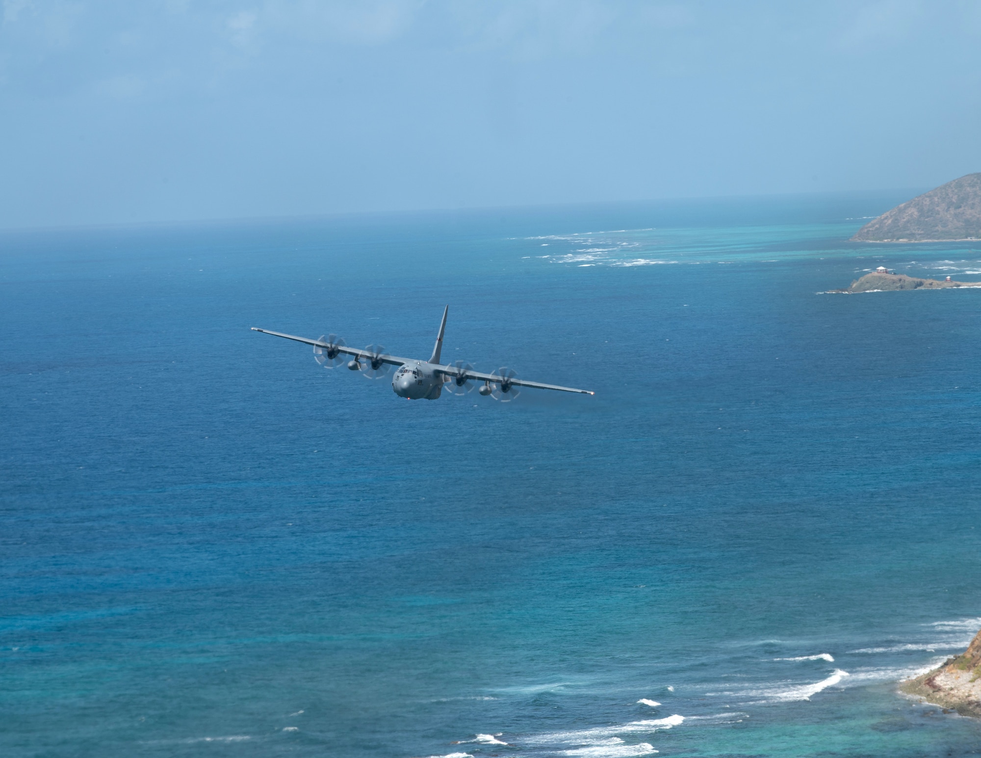U.S. Air Force C-130 Hercules from the 133rd Airlift Wing flies over St. Croix, U.S. Virgin Islands, April 11, 2025.