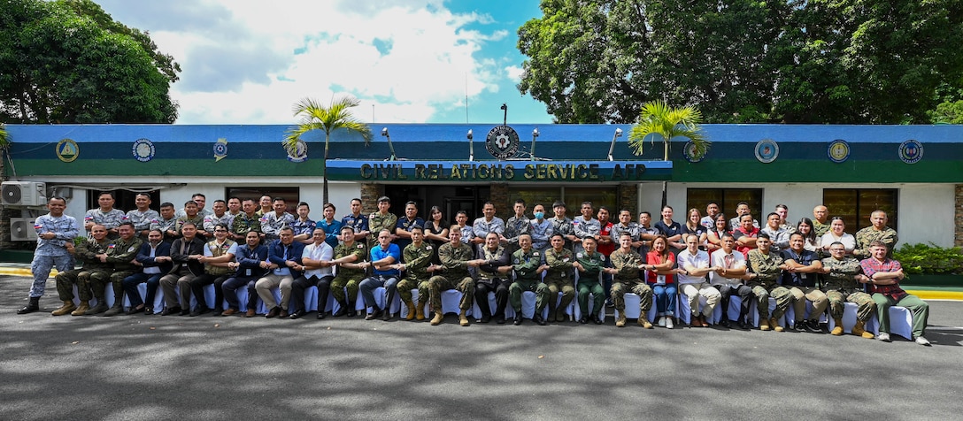 U.S. Marines, Armed Forces of the Philippines and Japan Self-Defense Forces service members and U.S. government officials pose for a group photo during a Humanitarian Assistance and Disaster Relief Tabletop Exercise in support of Exercise Balikatan 25 at Camp Aguinaldo, Manila, Philippines, May 1, 2025. Balikatan is a longstanding annual exercise between the Armed Forces of the Philippines and the U.S. military designed to strengthen our ironclad alliance, improve our capable combined force and demonstrate our commitment to regional security and stability. (U.S. Air Force photo by Airman 1st Class Carson Jeney)