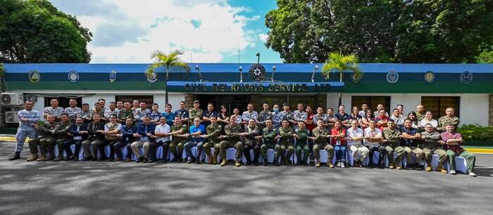 U.S. Marines, Armed Forces of the Philippines and Japan Self-Defense Forces service members and U.S. government officials pose for a group photo during a Humanitarian Assistance and Disaster Relief Tabletop Exercise in support of Exercise Balikatan 25 at Camp Aguinaldo, Manila, Philippines, May 1, 2025. Balikatan is a longstanding annual exercise between the Armed Forces of the Philippines and the U.S. military designed to strengthen our ironclad alliance, improve our capable combined force and demonstrate our commitment to regional security and stability. (U.S. Air Force photo by Airman 1st Class Carson Jeney)