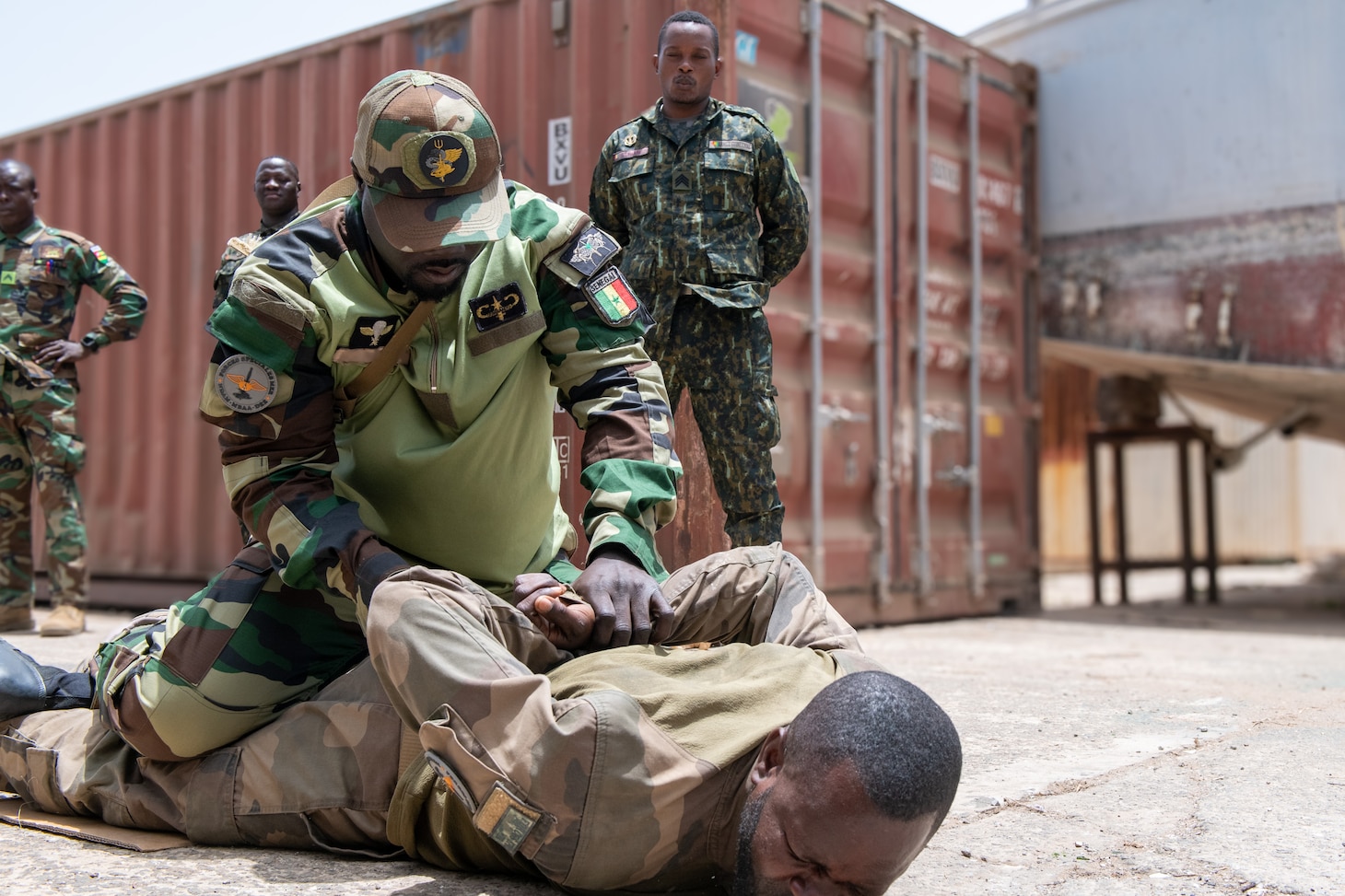 An instructor from the Senegalese naval special forces, Forces Speciale de Mer (FSM), leads a subject control exercise during FSM-led Visit, Board, Search, and Seizure (VBSS) training during Obangame Express 2025. Obangame Express is one of three regional maritime exercises led by U.S. Sixth Fleet as part of a comprehensive strategy to provide collaborative opportunities to African forces and international partners to address maritime security concerns.