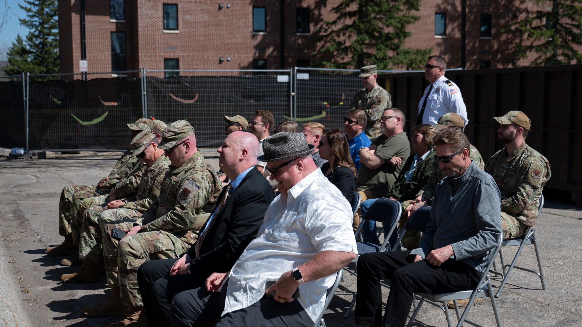 Airmen assigned to the 319th Reconnaissance Wing and civilians from the Grand Forks, ND, community attend the groundbreaking ceremony for the Bunch Hall dormitory at Grand Forks Air Force Base, N.D., May 7, 2025. The ceremony celebrated the start of the $14.2 million renovation project. (U.S. Air Force photo by Airman Nailah Pacheco)
