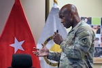 Brig. Gen. Freddy Adams, the Mission and Installation Contracting Command commanding general, hosts a town hall alongside his deputy Clay Cole and Command Sgt. Maj. JennyAnne Bright, the MICC command sergeant major with more than1,000 Mission and Installation Contracting Command leaders, civilian employees and Soldiers attending the hybrid event May 1, 2025, virtually and in-person, at Joint Base San Antonio-Fort Sam Houston, Texas.