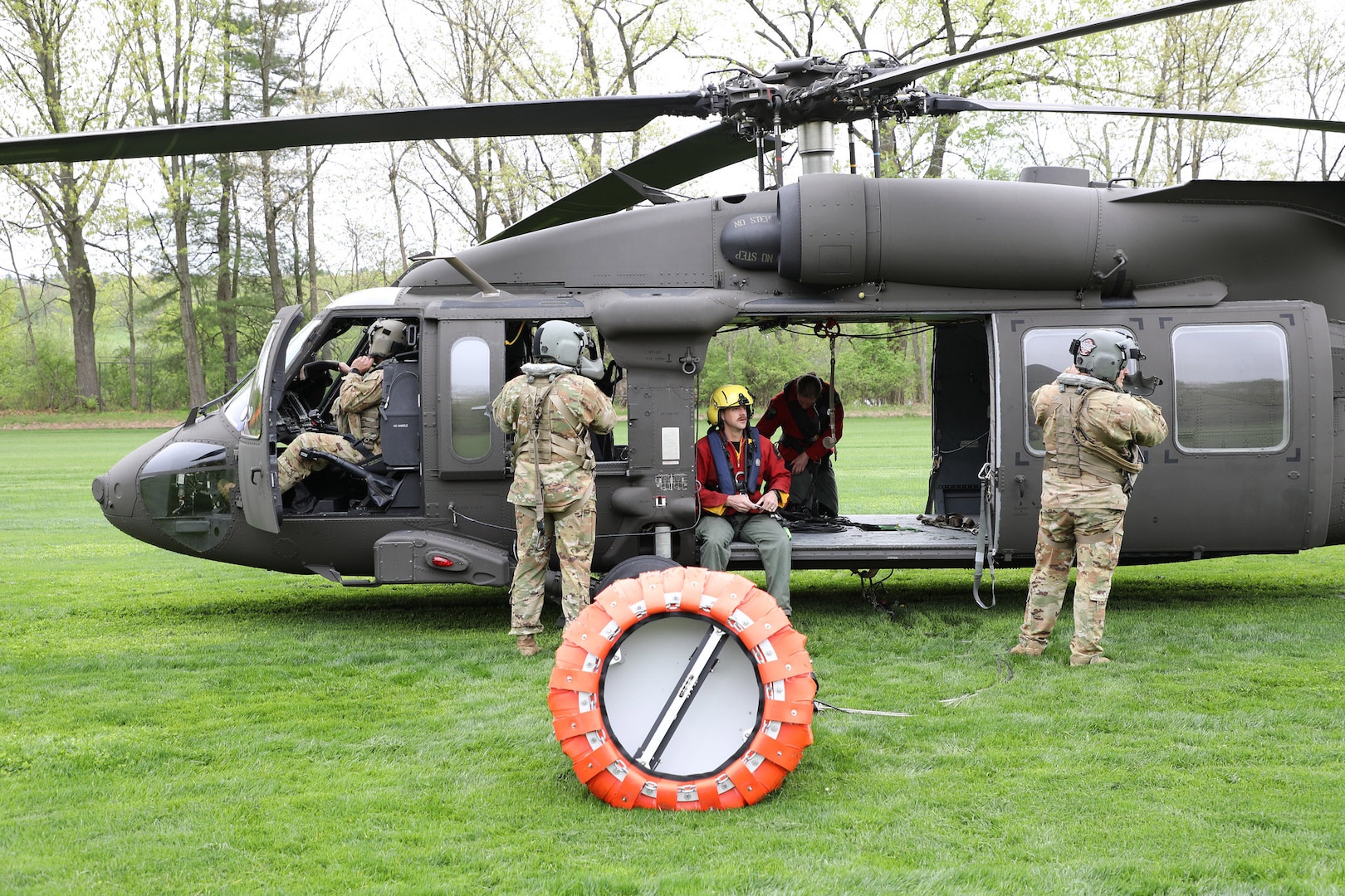 New York Army National Guard aircrews assigned to the 3rd Battalion, 142nd Aviation Regiment, prepare New York State Forest Rangers for familiarization training with water buckets for aerial firefighting in Schuylerville, New York, May 8, 2025.