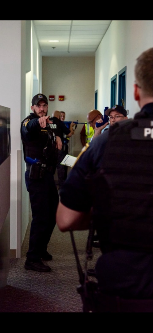 Defense Logistics Agency Distribution Columbus Police Lt. Robert McCusker directs fellow officers to establish a perimeter after the threat was neutralized during a large-scale active shooter exercise