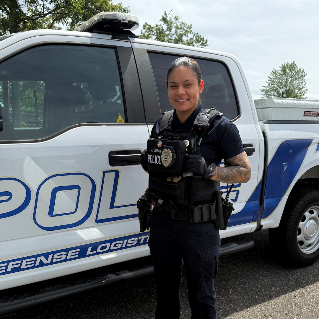 Defense Logistics Agency Headquarters Police Officer Jennifer Lozano poses for a photo next to a patrol truck