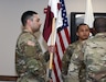 Staff Sgt. Tereso Hernandez, left, takes the unit colors as he assumes responsibility as detachment sergeant for the U.S. Army Medical Materiel Agency’s Headquarters and Headquarters Detachment during a change of responsibility ceremony May 2 at Fort Detrick, Maryland.