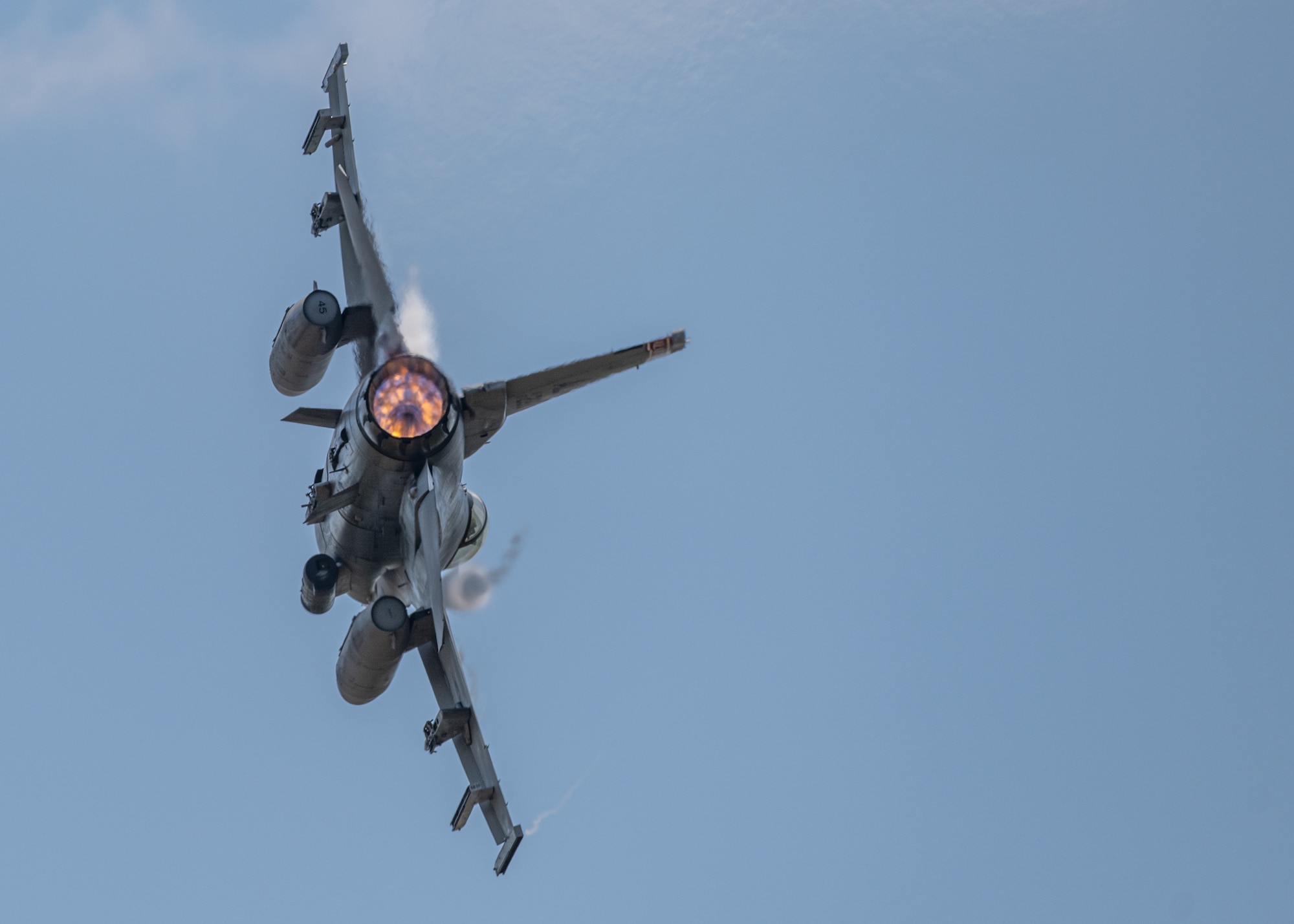 An F-16 Fighting Falcon assigned to the Alabama Air National Guard's 187th Fighter Wing banks during a performance at the 2021 Atlanta Air Show, Atlanta Regional Airport-Falcon Field, Ga., May 23, 2021. Four aircraft from the 187th Fighter Wing "Red Tails" performed a simulated "airfield assault" for air show attendees. (U.S. Air Force photo by Capt. Kip Sumner)