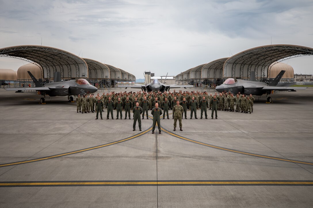 U.S. Navy Strike Fighter Squadron (VFA) 147, Carrier Air Wing (CVW) 5, poses for a group photo at Marine Corps Air Station Iwakuni, Japan, May 5, 2025. VFA-147 was selected to receive the Clarence Wade McClusky award. The award is given to the Navy’s most exceptional attack squadron. (U.S. Marine Corps photo by Lance Cpl. Maikeyla Reyes)