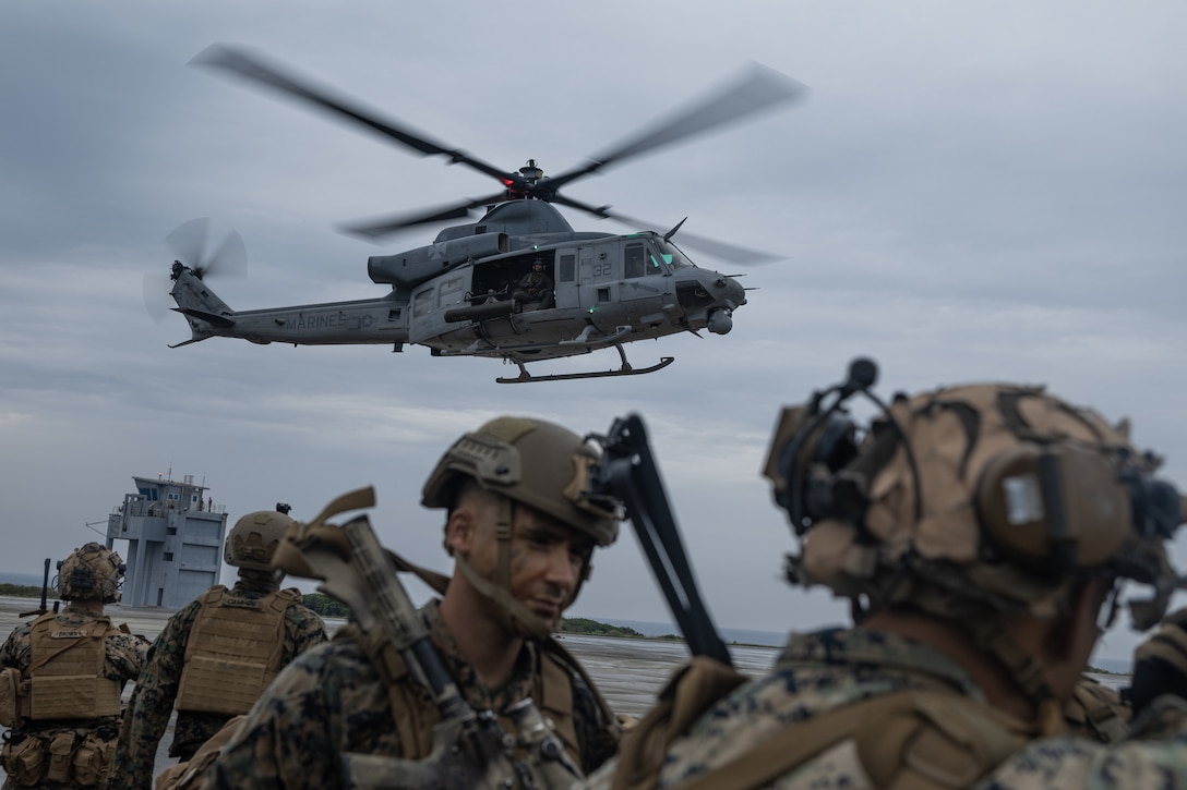 U.S. Marines with Animal Company, Battalion Landing Team 1st Battalion, 7th Marine Regiment, 31st Marine Expeditionary Unit, conduct a cherry picker drill with a UH-1Y Venom helicopter assigned to Marine Medium Tilt Rotor Squadron 265 (Rein.), during a simulated raid in support of MEU exercise at Ie Shima, Okinawa, Japan, May 7, 2025. The raid simulated employing Marines to rapidly capture and control objectives essential to operations. The 31st MEU, the Marine Corps’ only continuously forward-deployed MEU, provides a flexible and lethal force, ready to perform a wide range of military operations as the premiere crisis response force in the Indo-Pacific region. (U.S. Marine Corps photo by Lance Cpl. Victor Gurrola).