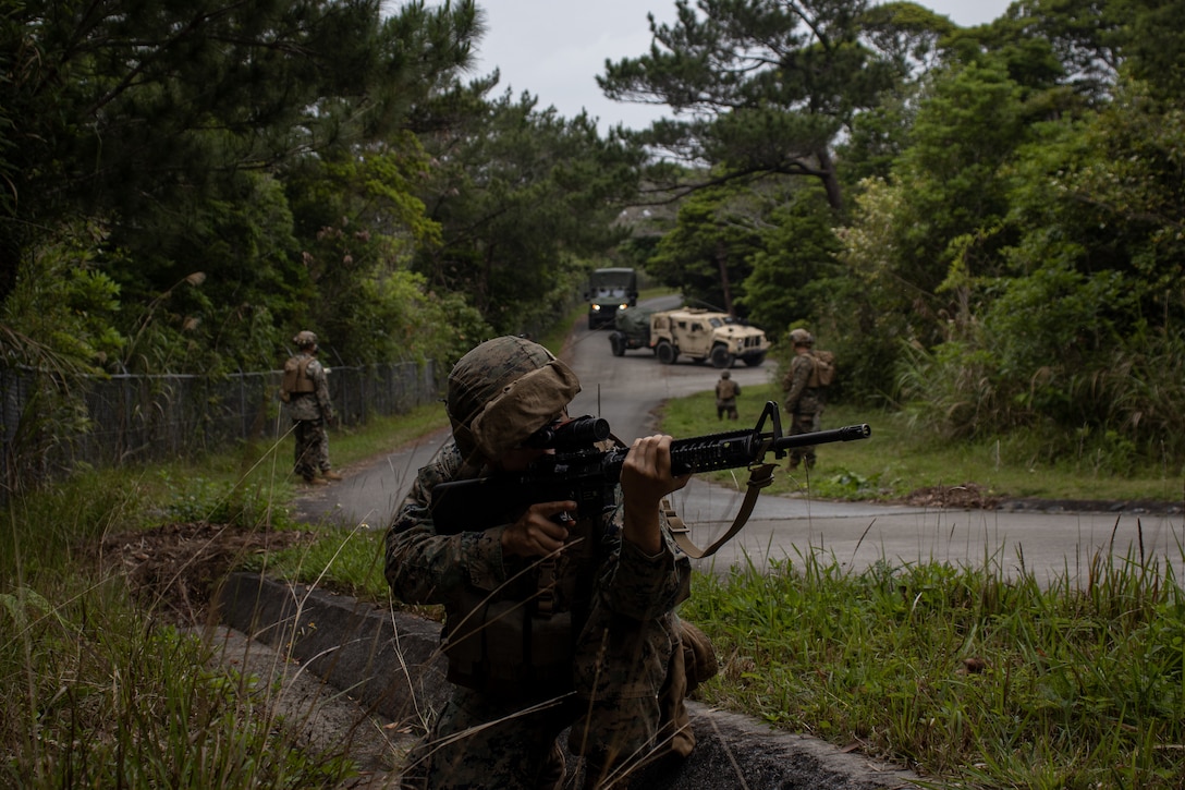 U.S. Marines Corps Miles Armstrong, a combat engineer with Combat Logistics Battalion 31, 31st Marine Expeditionary Unit, posts security during a reconnaissance patrol during a Combat Supply Security Area simulation as part of MEU Exercise at LZ Dodo, Camp Hansen, Okinawa, Japan, May 7, 2025. Marines with CLB-Alpha Company participated in an exercise to enhance interoperability and strengthen ship-to-shore capabilities. The 31st MEU, the Marine Corps' only continuously forward-deployed MEU, provides a flexible force ready to perform a wide-range of military operations across the Indo-Pacific region. Armstrong is a native of Arizona. (U.S. Marine Corps photo by Sgt. Peter Rawlins)
