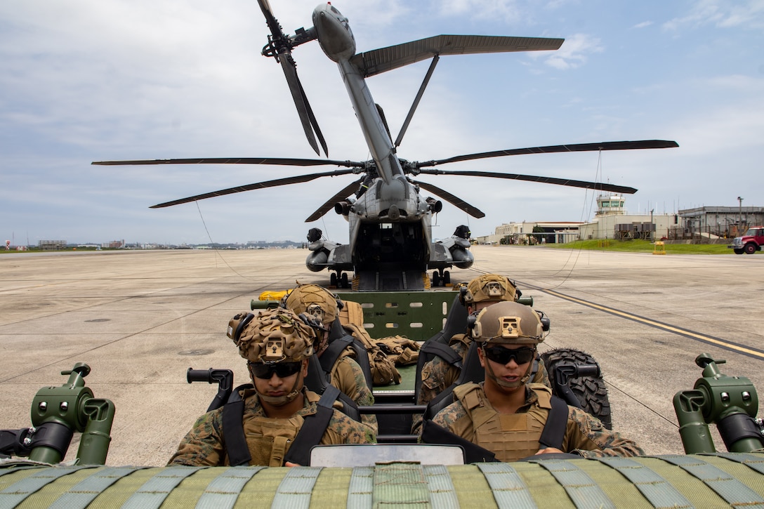 U.S. Marines with Weapons Company, Battalion Landing Team 1st Battalion, 7th Marine Regiment, 31st Marine Expeditionary Unit, load into an MRZR all-terrain vehicle during vehicle on and off drills training as part of MEU Exercise at Marine Corps Air Station Futenma, Okinawa, Japan, May 6, 2025. The purpose of vehicle on and off drills training familiarizes Marines to efficiently deploy and evacuate tactical vehicles using different aircraft. The 31st MEU, the Marine Corps' only continuously forward-deployed MEU, provides a flexible force ready to perform a wide-range of military operations across the Indo-Pacific region. (U.S. Marine Corps photo by Sgt. Peter Rawlins)