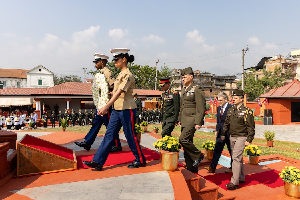 U.S. and Nepali service members carry a Gerbera Daisy flower wreath to the Eternal Flame Memorial during the 10th Anniversary Operation Sahayogi Haat Wreath Laying Ceremony at the Nepal Military Museum, Kathmandu, Nepal, May 12, 2025.