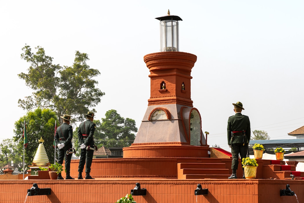 onor guardsmen with the Nepali Army stand in front of the Eternal Flame Memorial during the 10th Anniversary Operation Sahayogi Haat Wreath Laying Ceremony at the Nepal Military Museum, Kathmandu, Nepal, May 12, 2025.