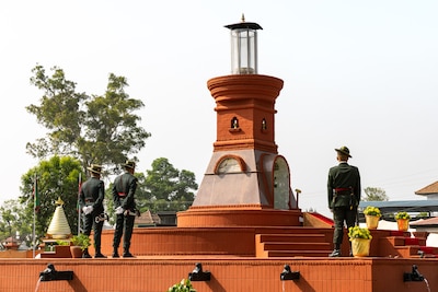 onor guardsmen with the Nepali Army stand in front of the Eternal Flame Memorial during the 10th Anniversary Operation Sahayogi Haat Wreath Laying Ceremony at the Nepal Military Museum, Kathmandu, Nepal, May 12, 2025.