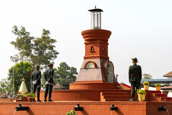 onor guardsmen with the Nepali Army stand in front of the Eternal Flame Memorial during the 10th Anniversary Operation Sahayogi Haat Wreath Laying Ceremony at the Nepal Military Museum, Kathmandu, Nepal, May 12, 2025.