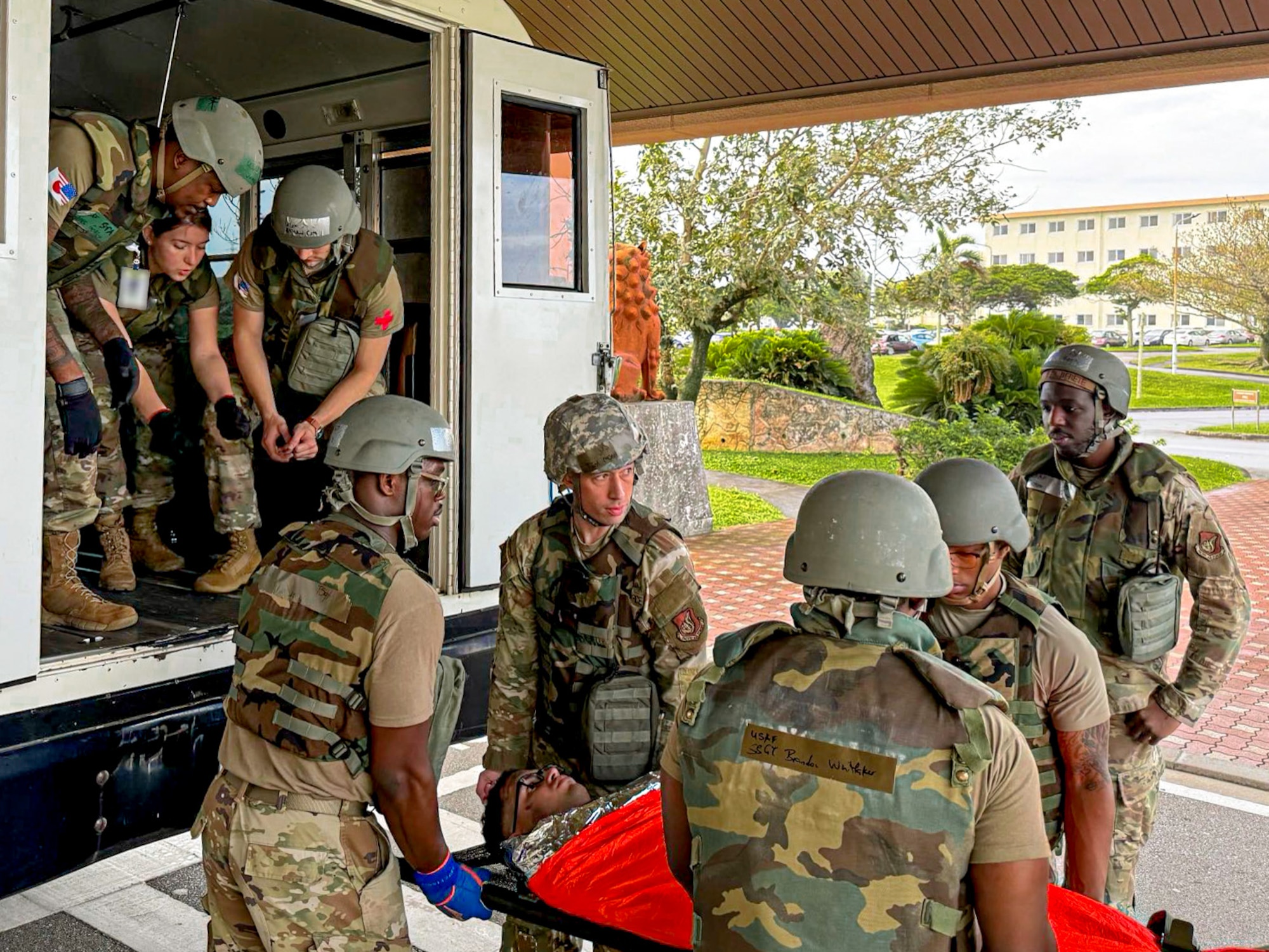 U.S. Air Force Airmen assigned to the 18th Medical Group load a simulated patient on a stretcher into a transfer vehicle during a mass casualty scenario during a routine readiness exercise at Kadena Air Base, Japan, May 8, 2025.
