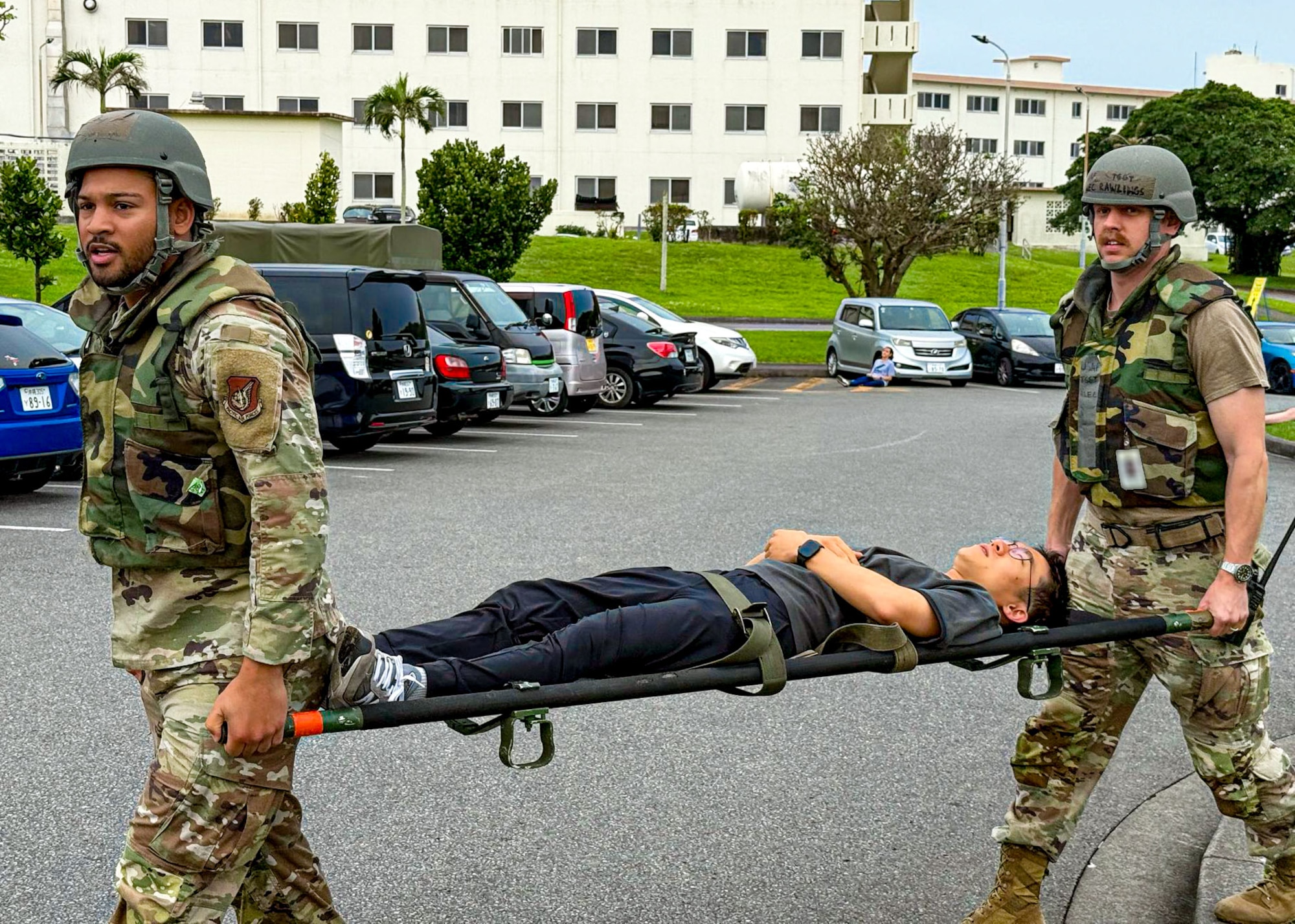 U.S. Air Force Airmen assigned to the 18th Medical Group transfer a simulated patient during a mass casualty scenario during a routine readiness exercise at Kadena Air Base, Japan, May 8, 2025.