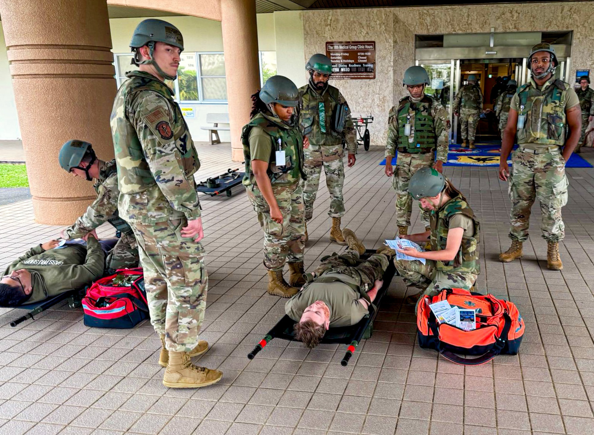 U.S. Air Force Airmen assigned to the 18th Medical Group treat a simulated patient during a mass casualty scenario in support of a routine readiness exercise at Kadena Air Base, Japan, May 8, 2025.