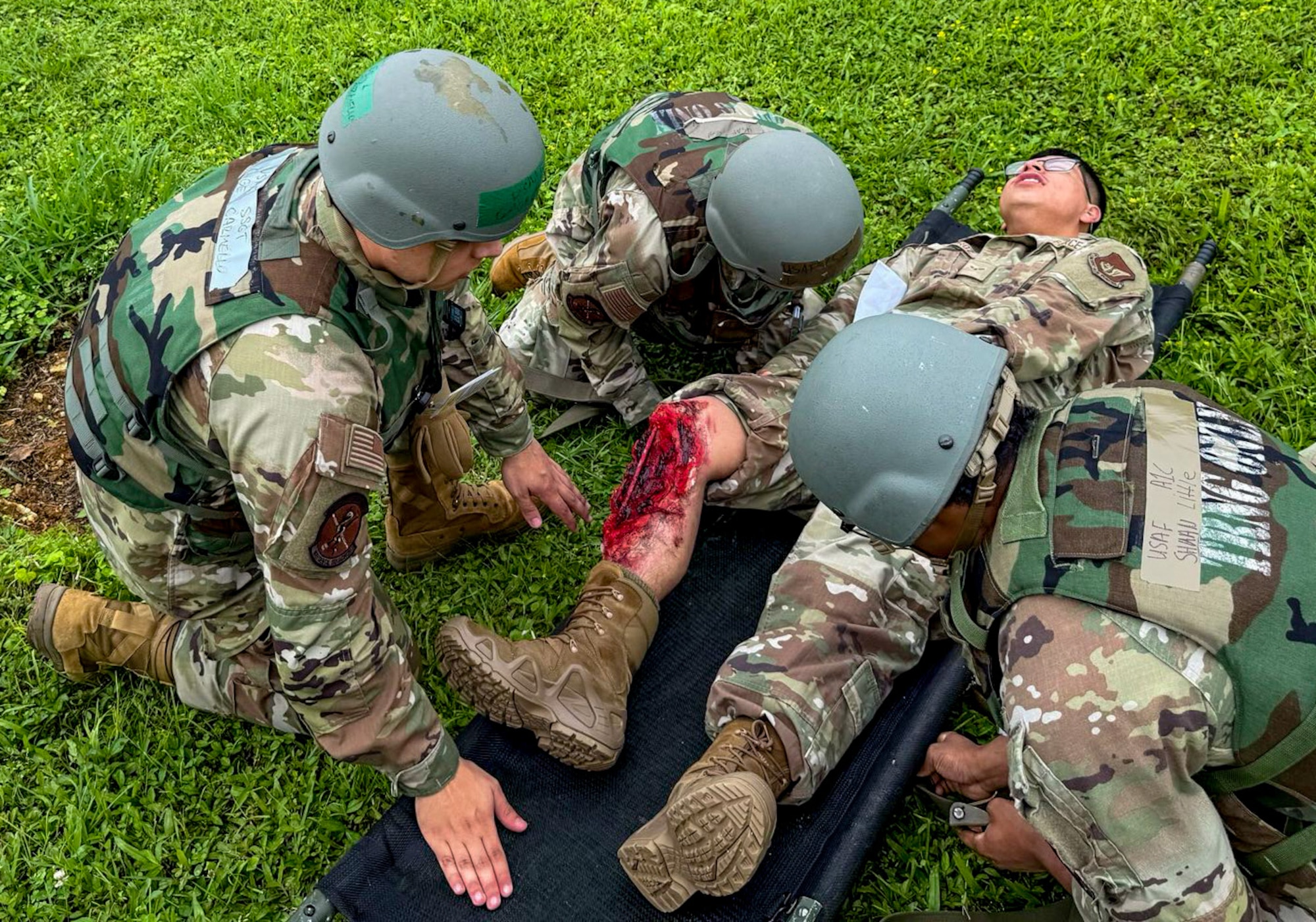 U.S. Air Force Airmen assigned to the 18th Medical Group transfer a simulated patient onto a stretcher during a mass casualty scenario during a routine readiness exercise at Kadena Air Base, Japan, May 8, 2025.