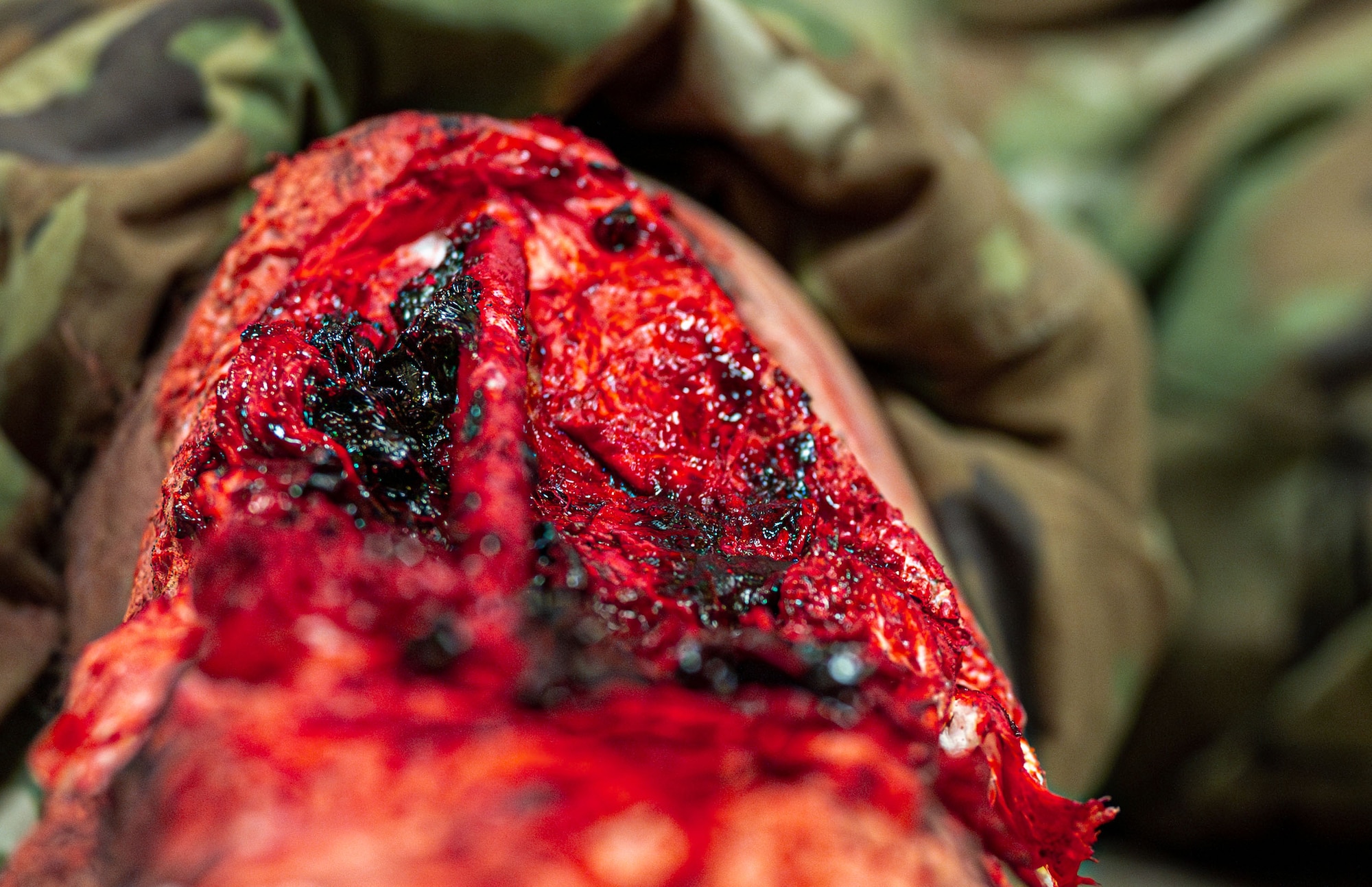 Moulage on a volunteer's leg displays a simulated injury for a mass casualty exercise at Kadena Air Base, Japan, May 8, 2025.