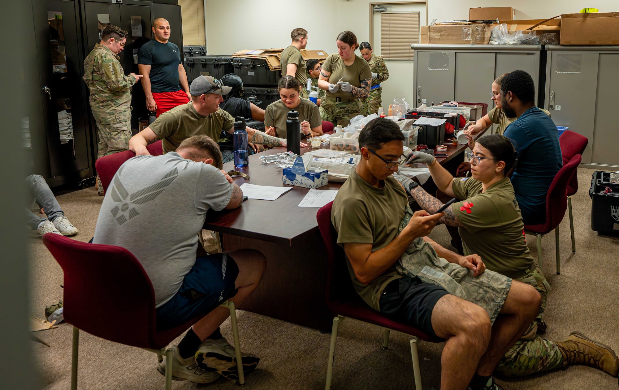 U.S. Air Force Airmen assigned to the 18th Medical Group apply moulage to volunteers for a simulated mass casualty exercise at Kadena Air Base, Japan, May 8, 2025.