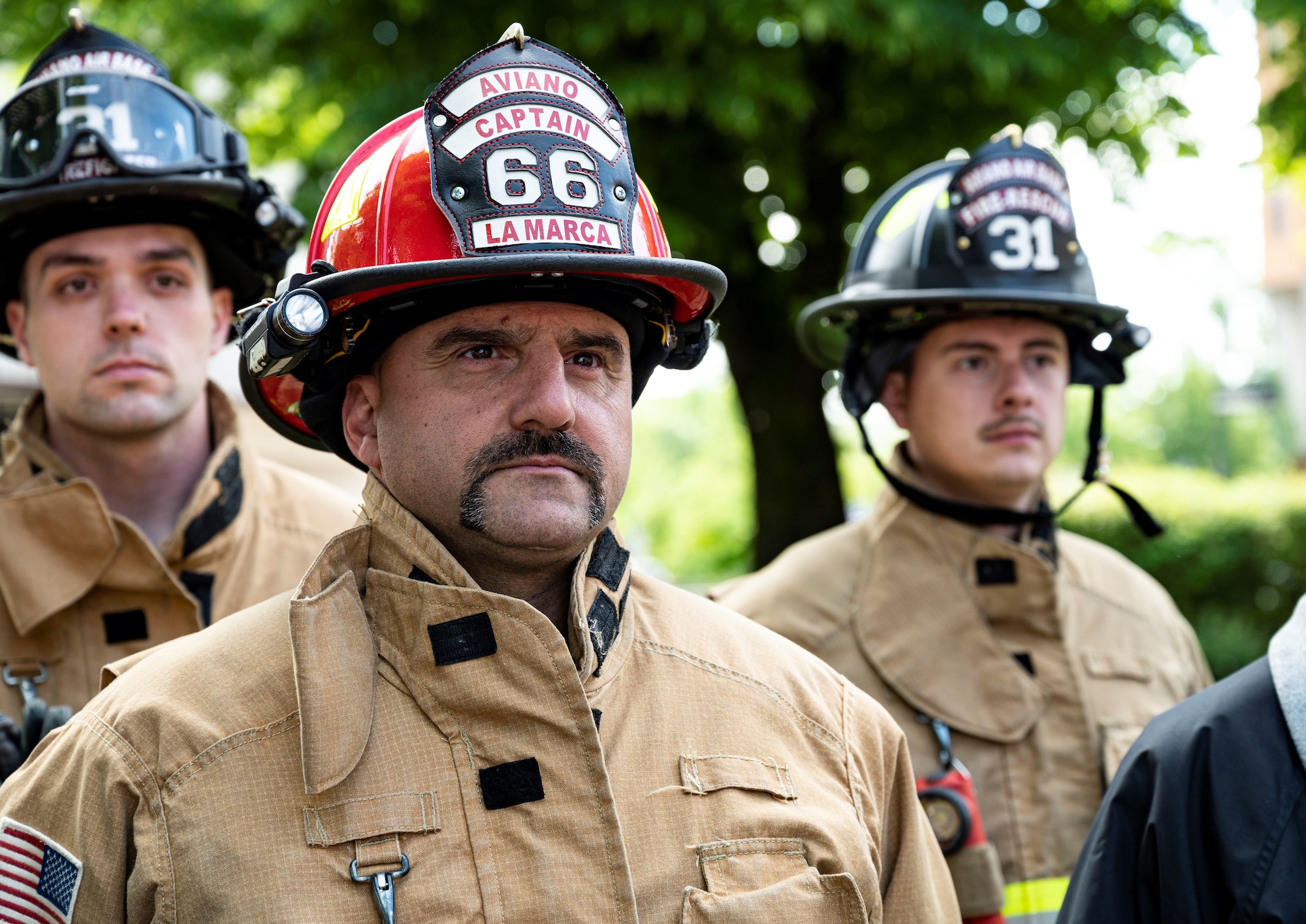 firefighters standing at attention