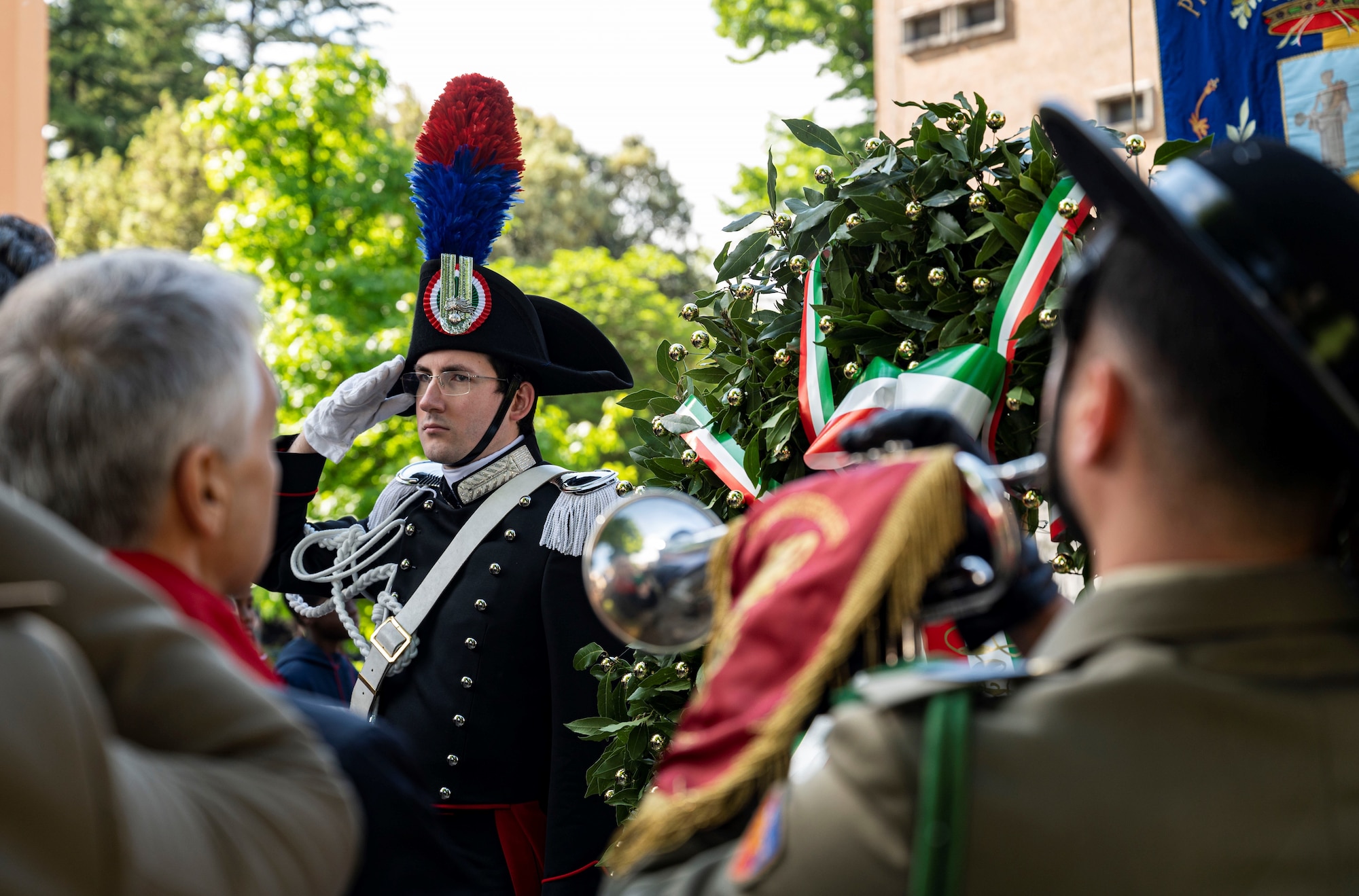 Man salutes at ceremony