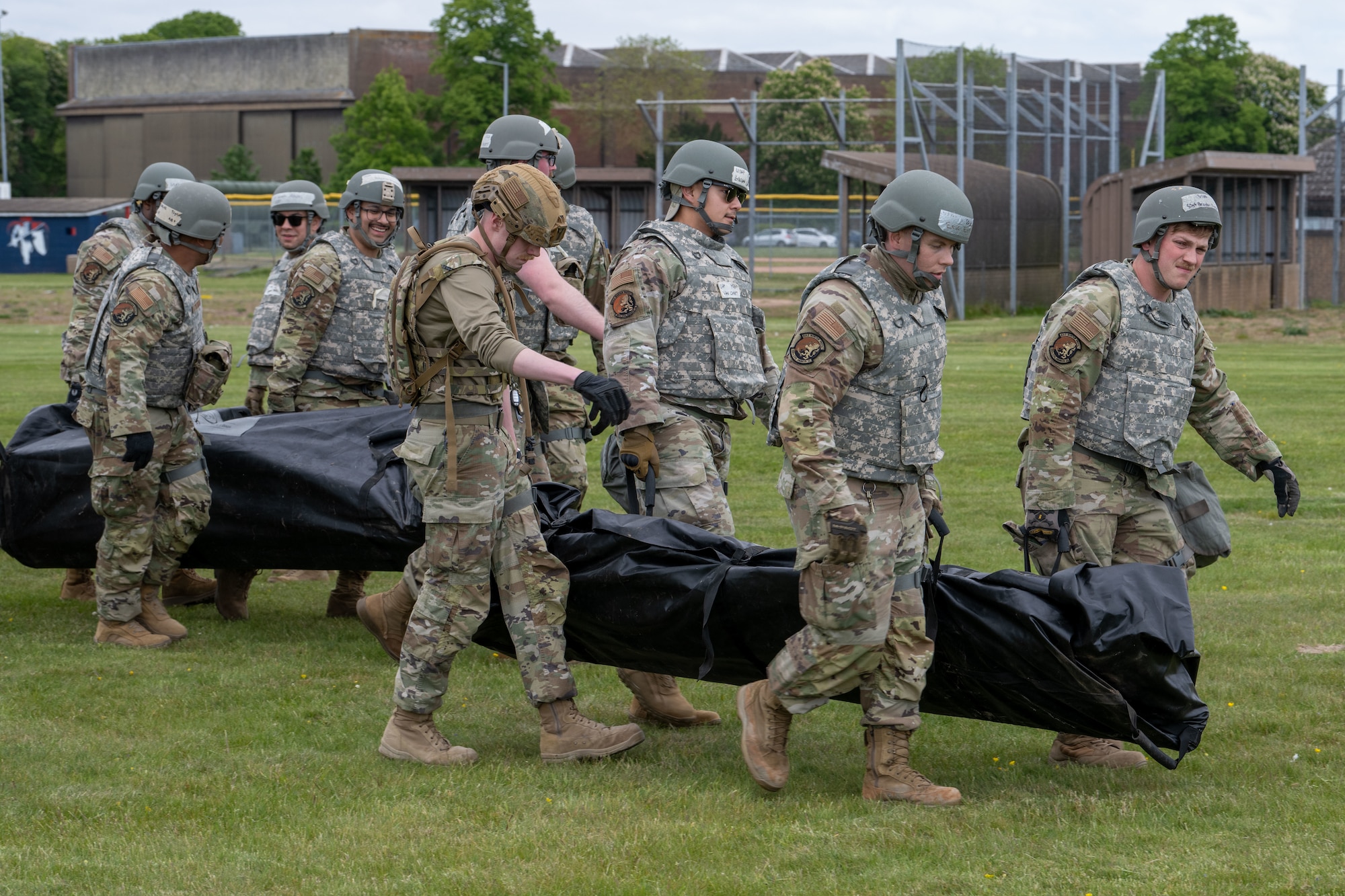 U.S. Airmen assigned to the 100th Civil Engineer Squadron work together to build temporary tents during combat readiness inspection Skyway Chariot at RAF Feltwell, England, May 8, 2025.