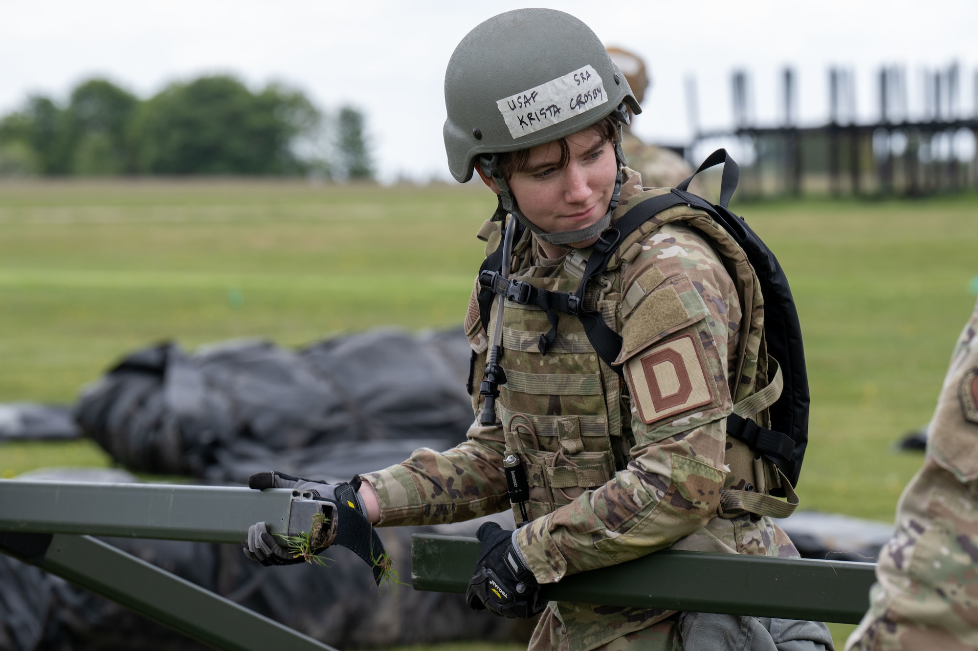 A U.S. Airman assigned to the 100th Civil Engineer Squadron helps build temporary tents during combat readiness inspection Skyway Chariot at RAF Feltwell, England, May 8, 2025.