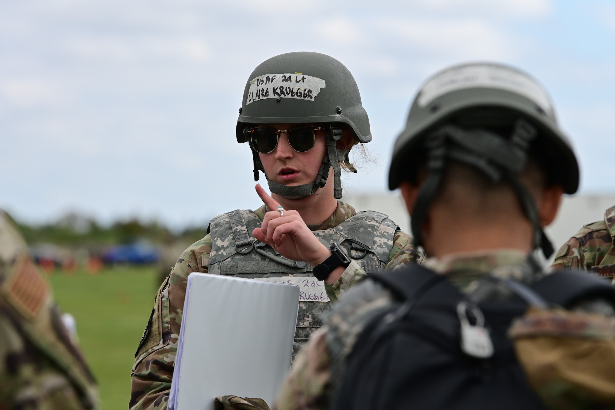 U.S. Air Force 2nd Lt. Claire Krurger, 100th Civil Engineer Squadron Readiness and Emergency Management Flight commander, briefs Airmen on their simulated deployment location as part of combat readiness inspection Skyway Chariot at RAF Feltwell, England, May 8, 2025.